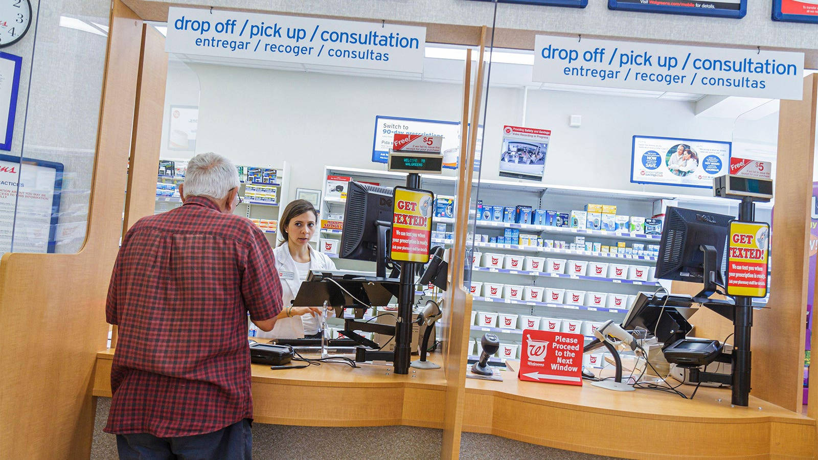 Senior Man Making Purchase At Pharmacy Background