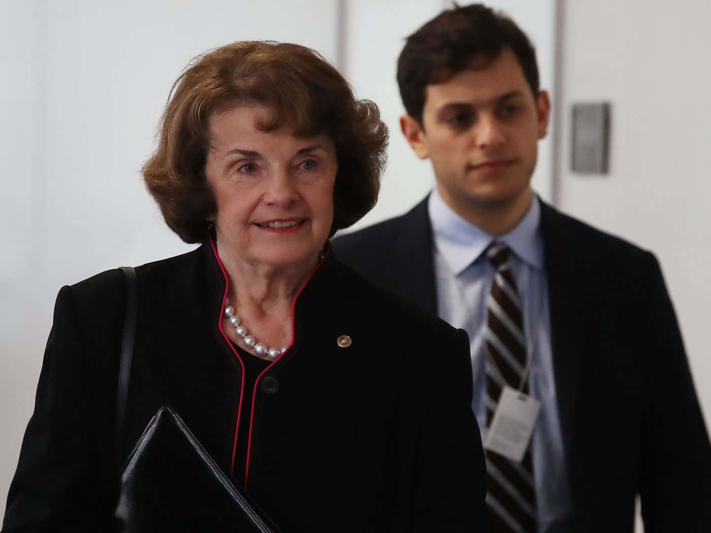 Senior U.s. Senator Dianne Feinstein Accompanied By A Bodyguard