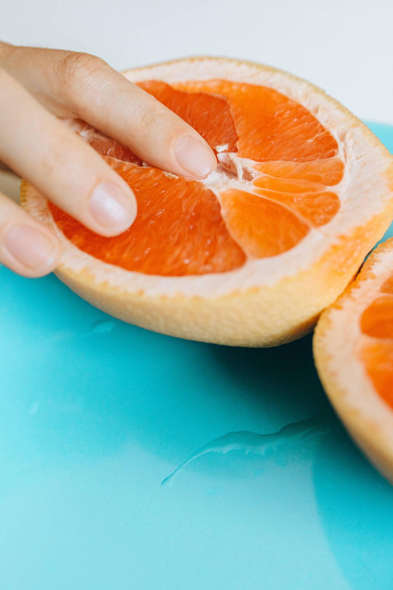 Sensual Touch With Grapefruit Background