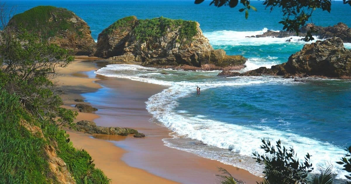 Serene Beach View In Oaxaca, Mexico Background