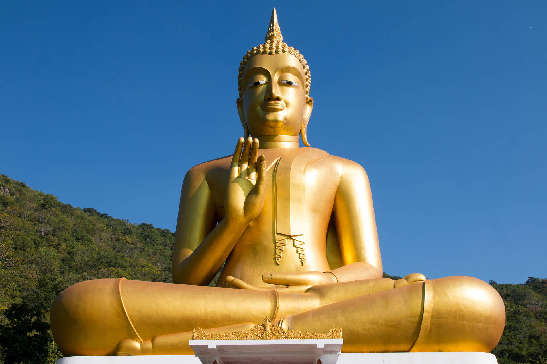 Serene Golden Buddha Statue On Desktop Background