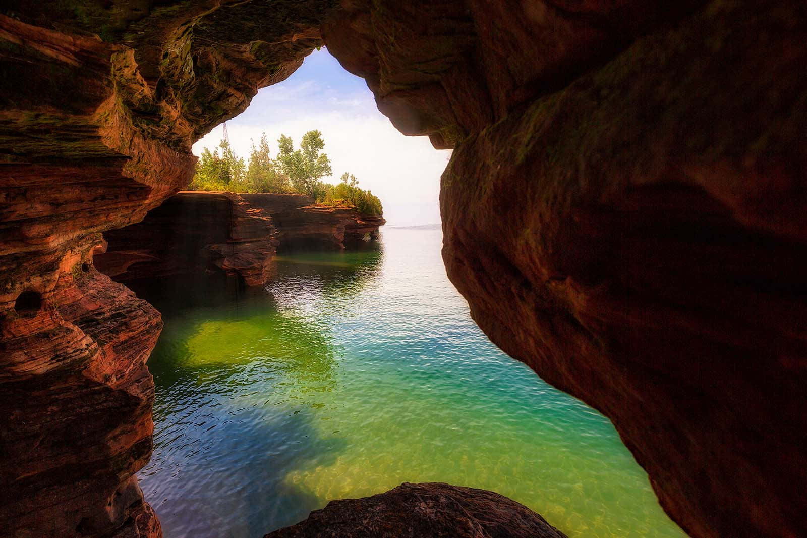 Serene_ Lake_ View_ Through_ Rock_ Arch