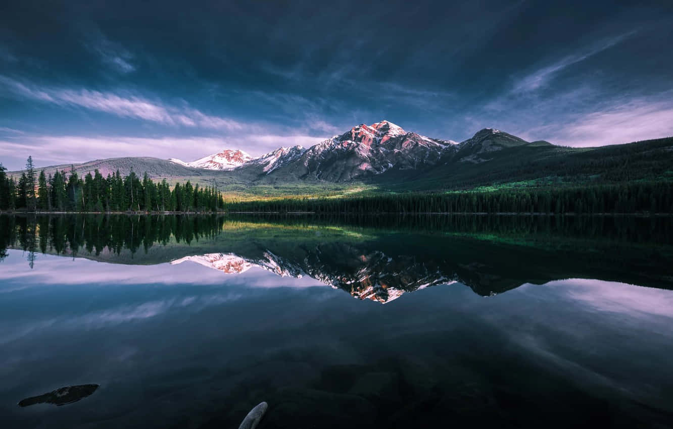 Serene Lake Water At Jasper National Park Background