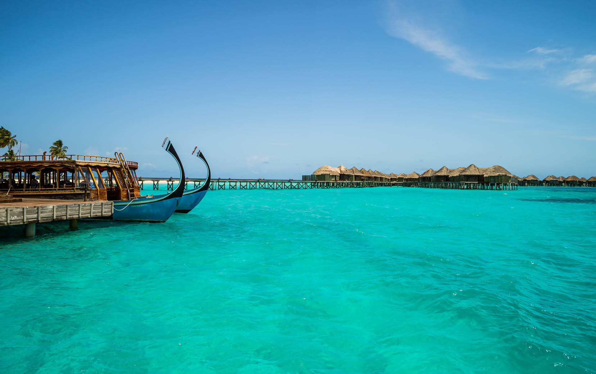 Serene Maldivian Escape With Dhoni Boat Background