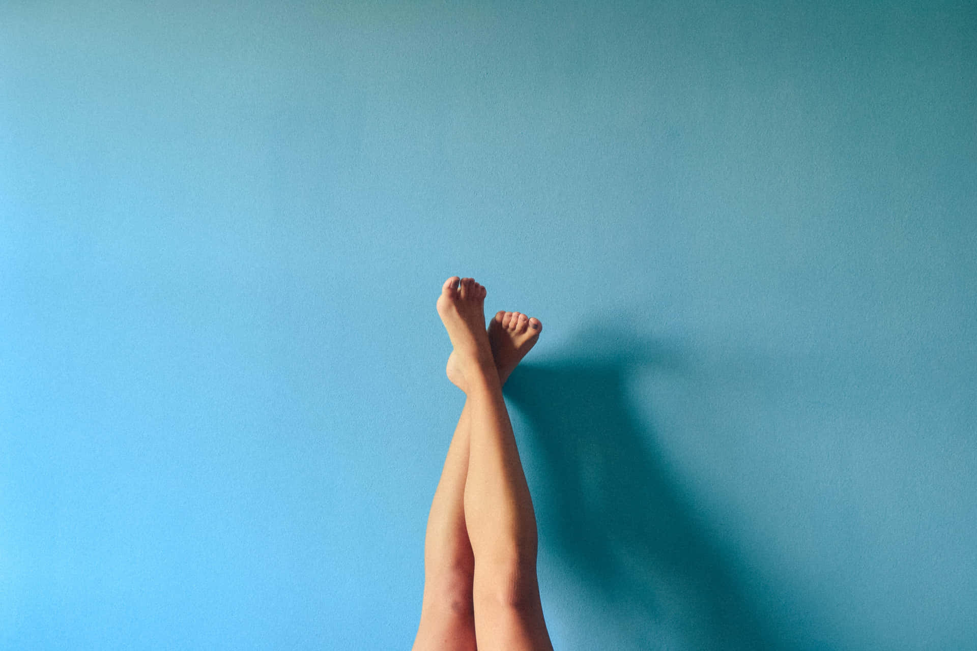 Serene Moments - Female Feet Crossed And Raised Background