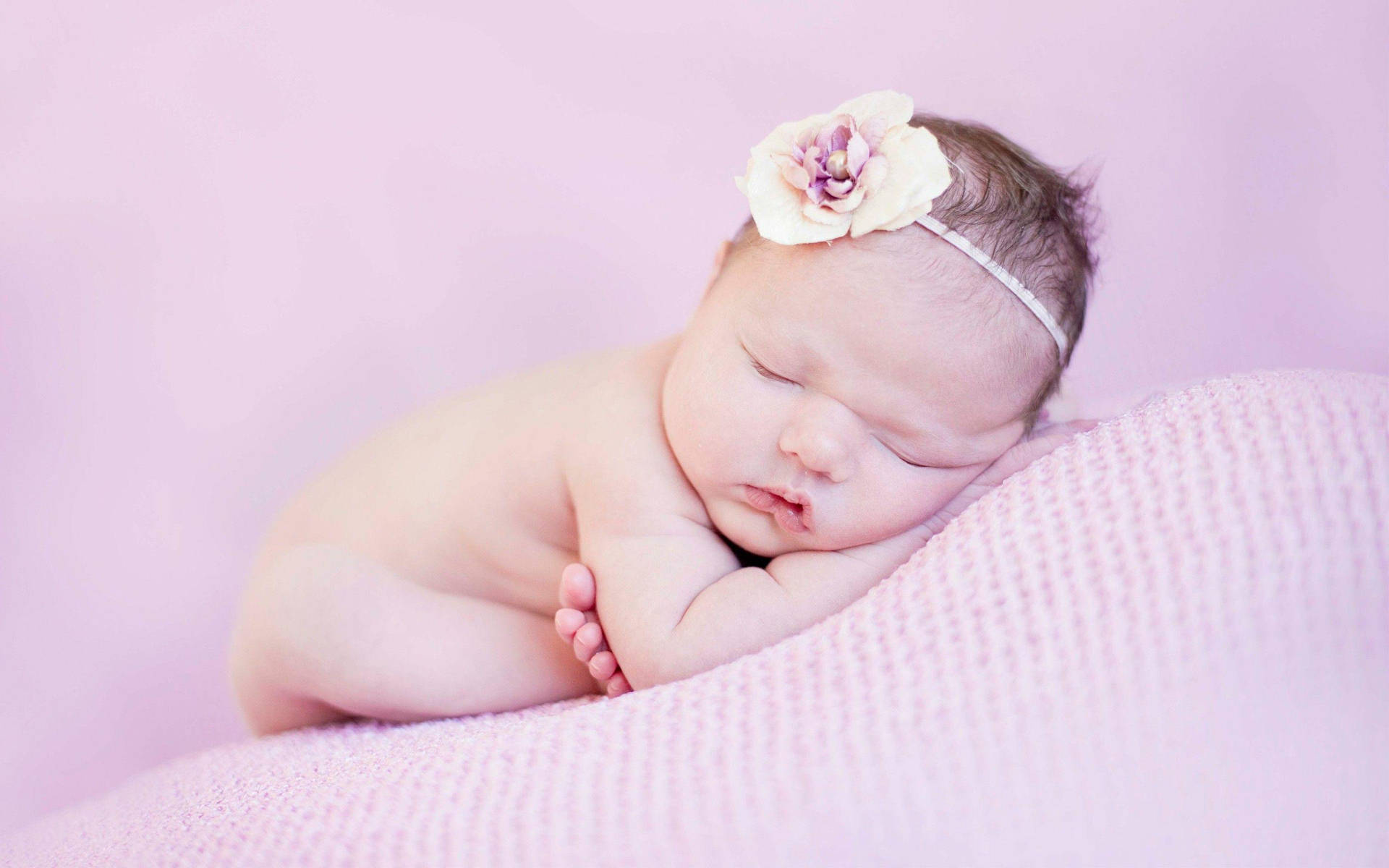 Serene Newborn Sleeping Peacefully Background