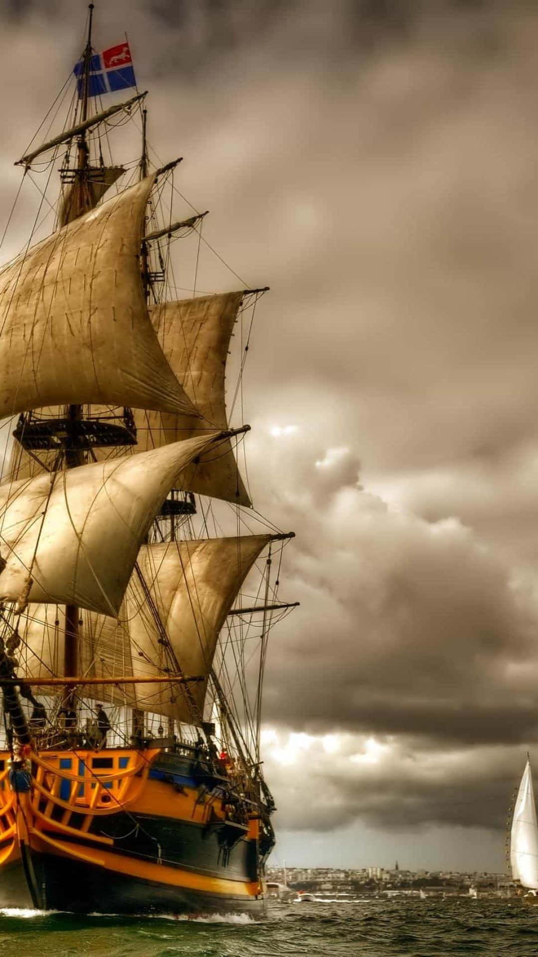 Serene Sailboat On Crystal Clear Sea