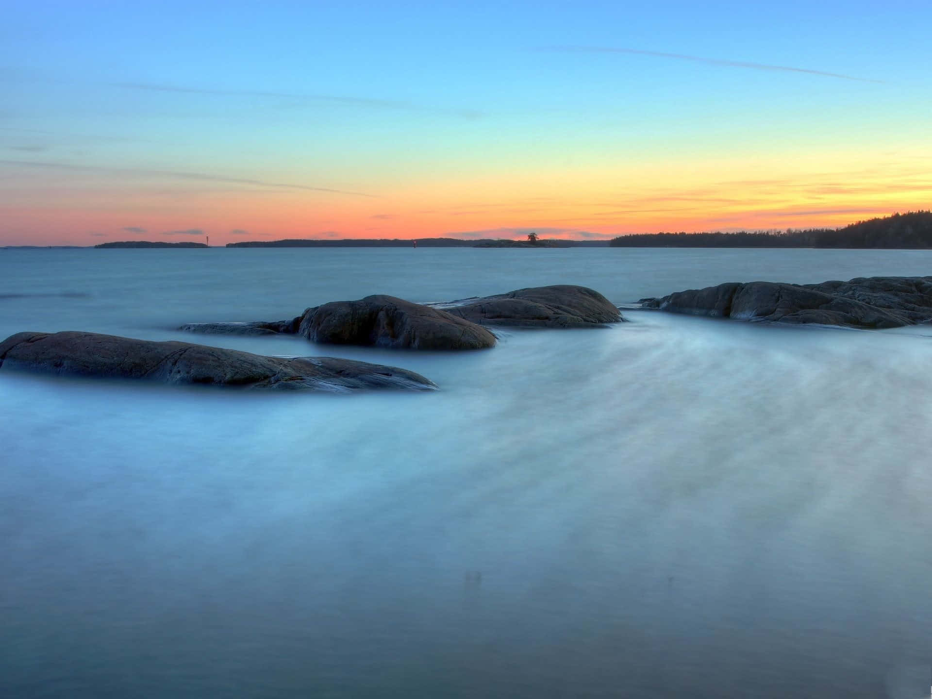 Serene Scenery Of Tranquil Waters Background