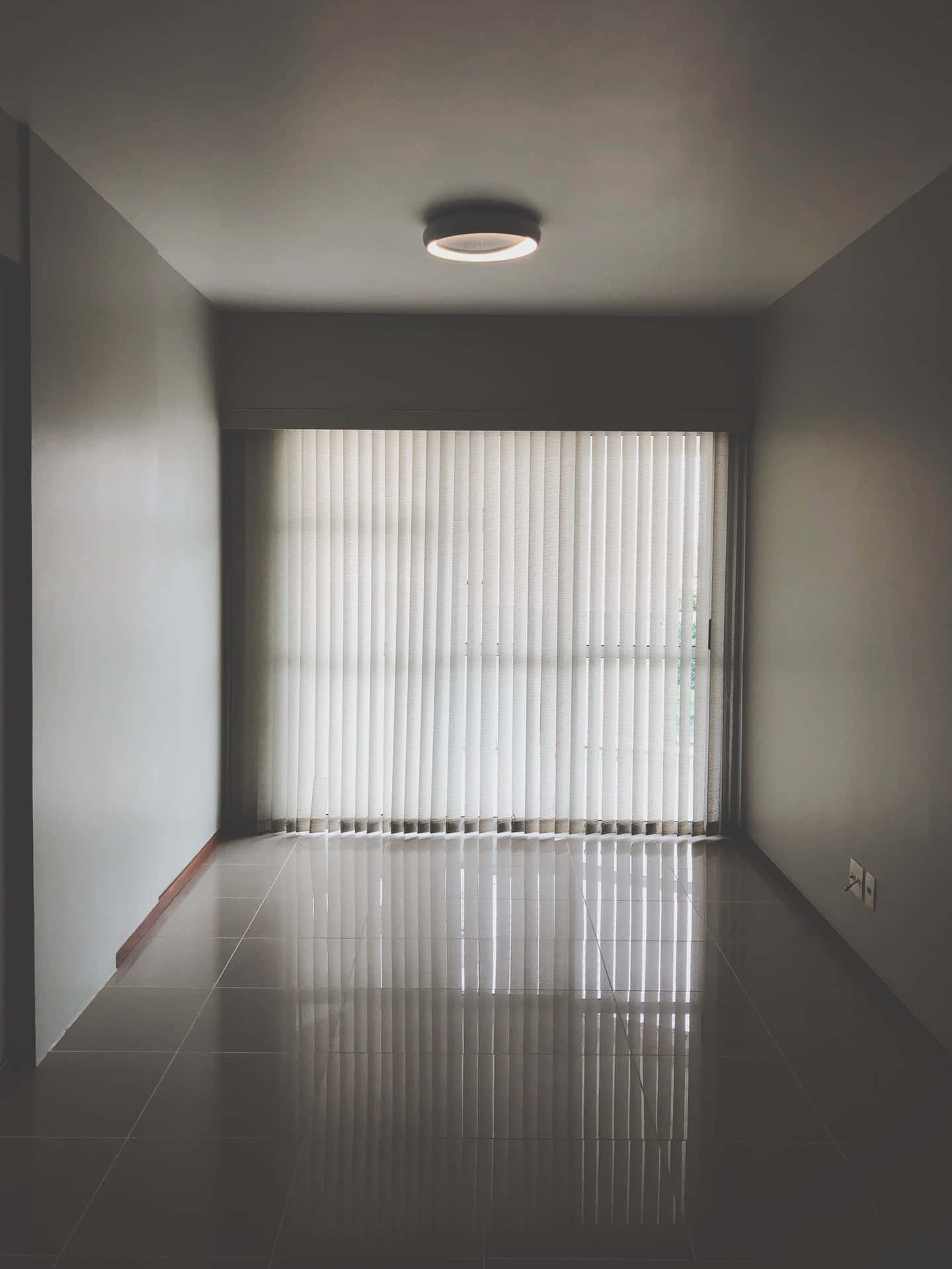 Serene Simplicity: An Empty Room With Closed Curtains