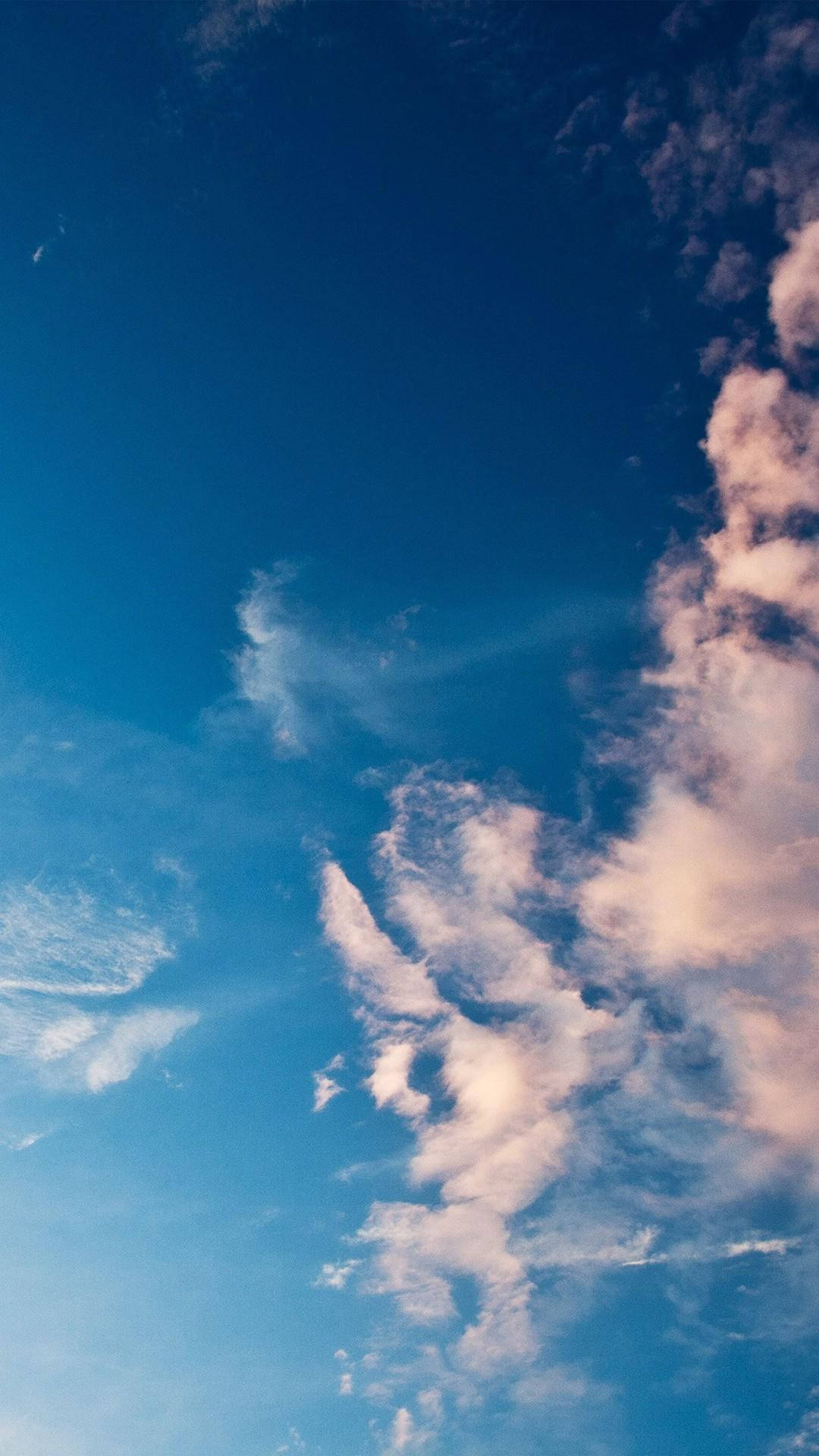 Serene Sky With Light Blue Phone Background