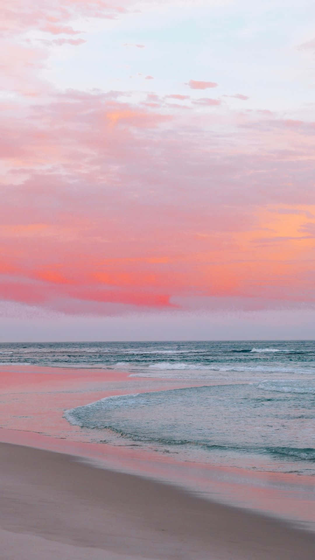 Serene Sunset At Pink Beach Background