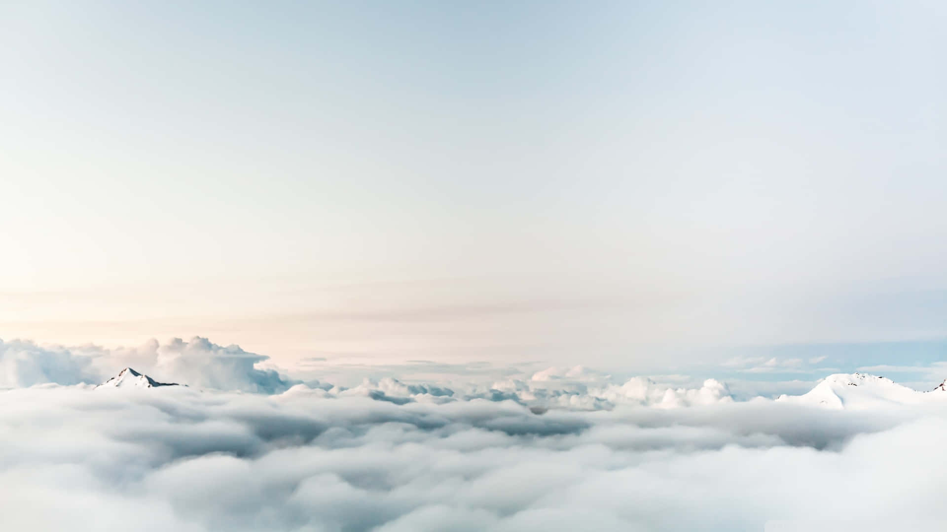 Serene View Of White Clouds Flowing Against The Blue Sky