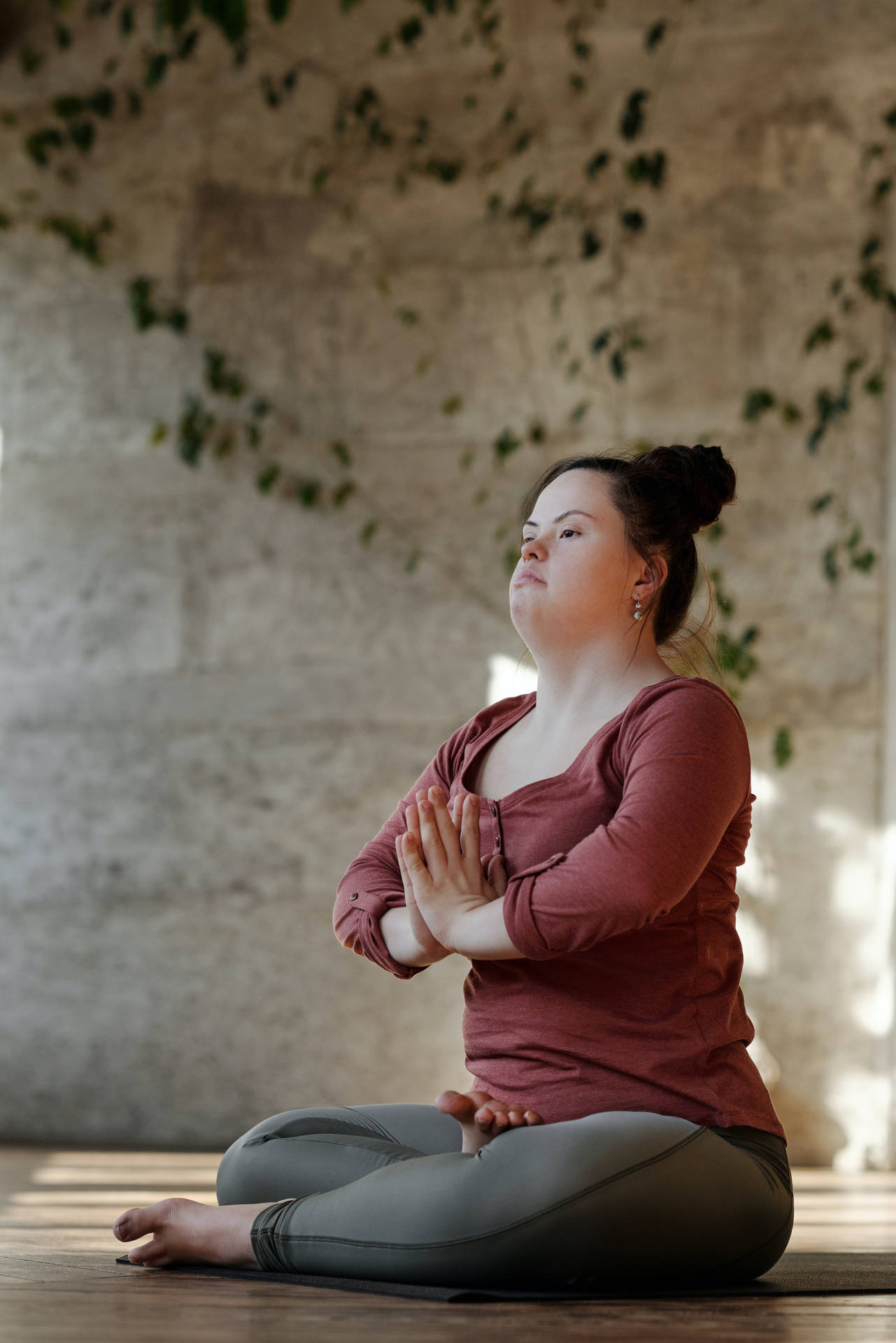 Serenity Redefined: A Girl Meditating In Solitude Background