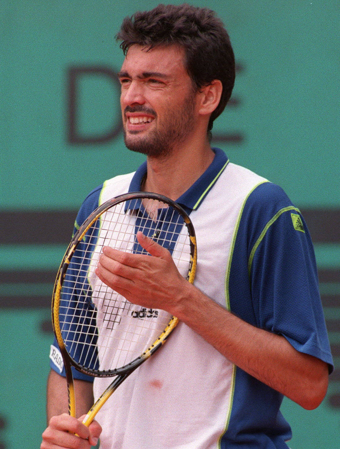 Sergi Bruguera Holding Racket Background