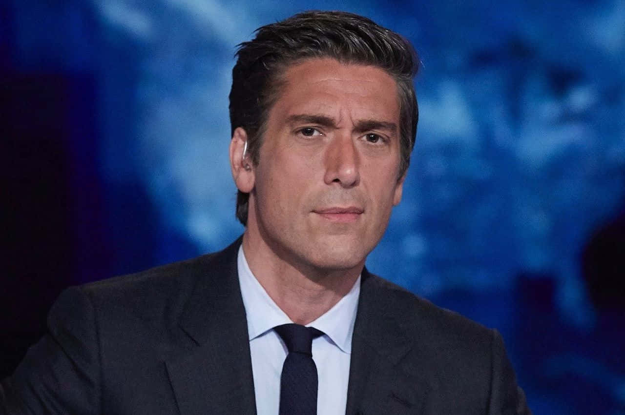 Serious Face Of David Muir Background