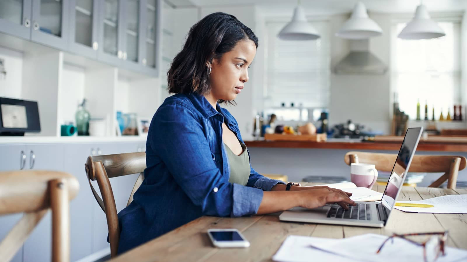 Serious Secretary Working With Laptop