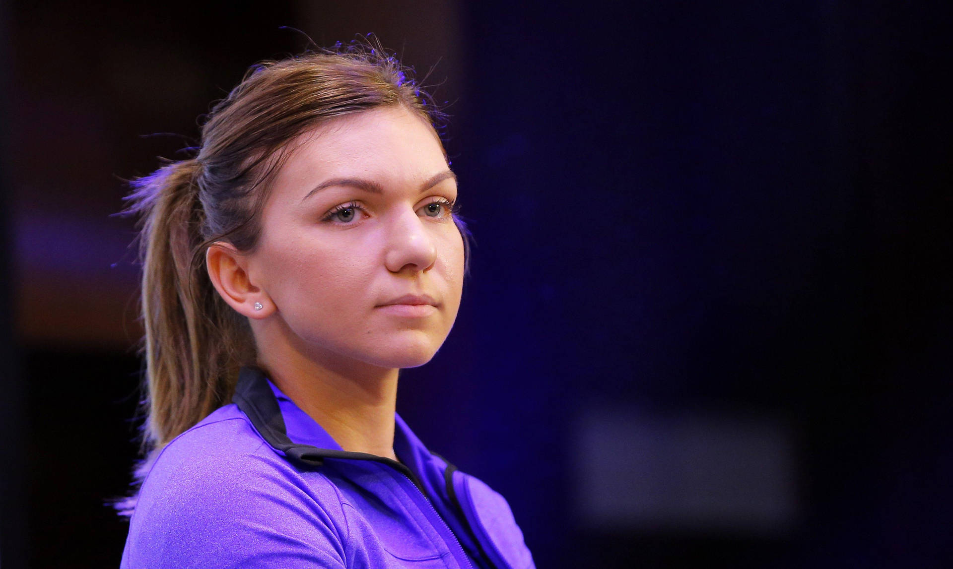 Serious Simona Halep In Purple Background