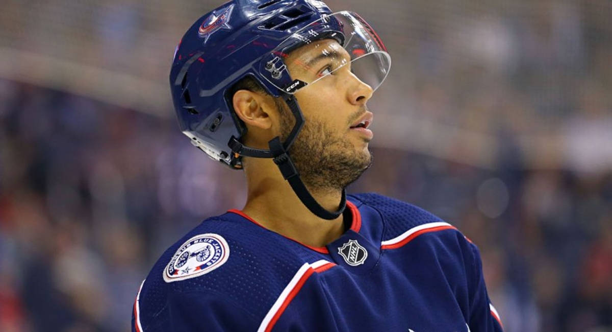 Seth Jones From Columbus Blue Jackets Looking Up Background