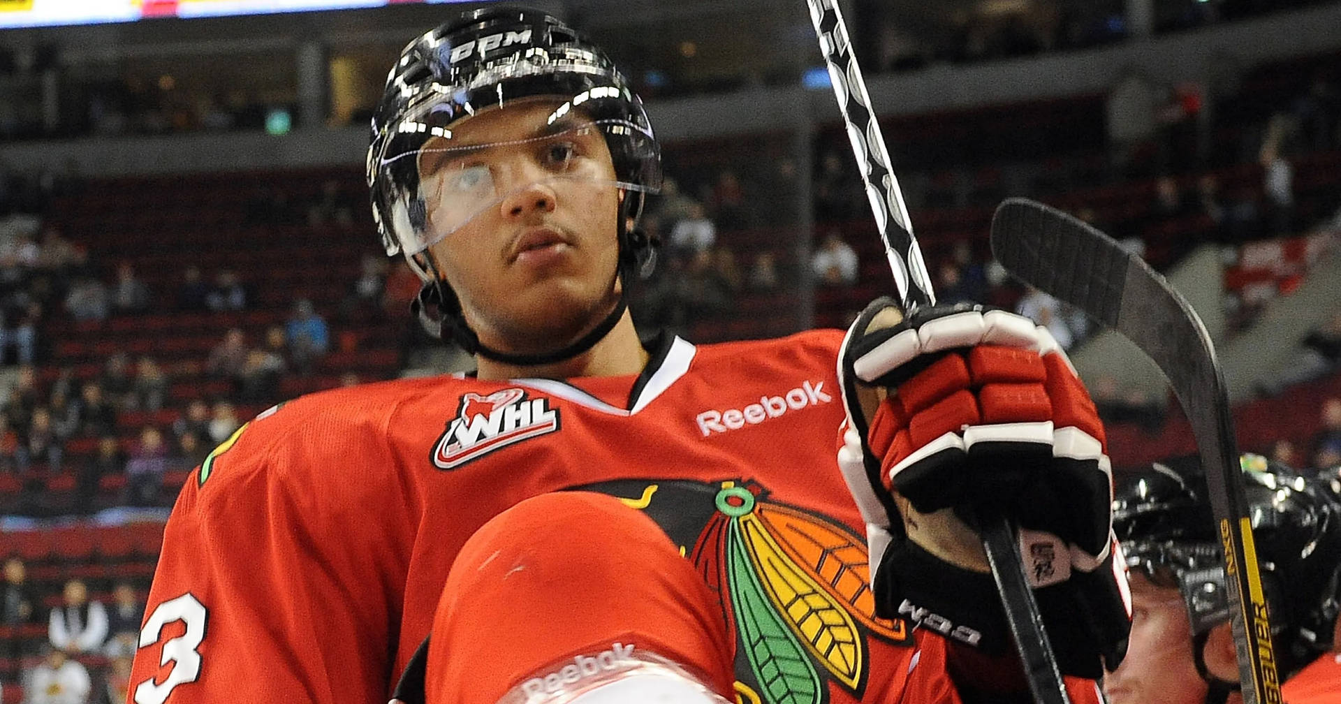 Seth Jones Holding Hockey Stick In Fierce Expression Background