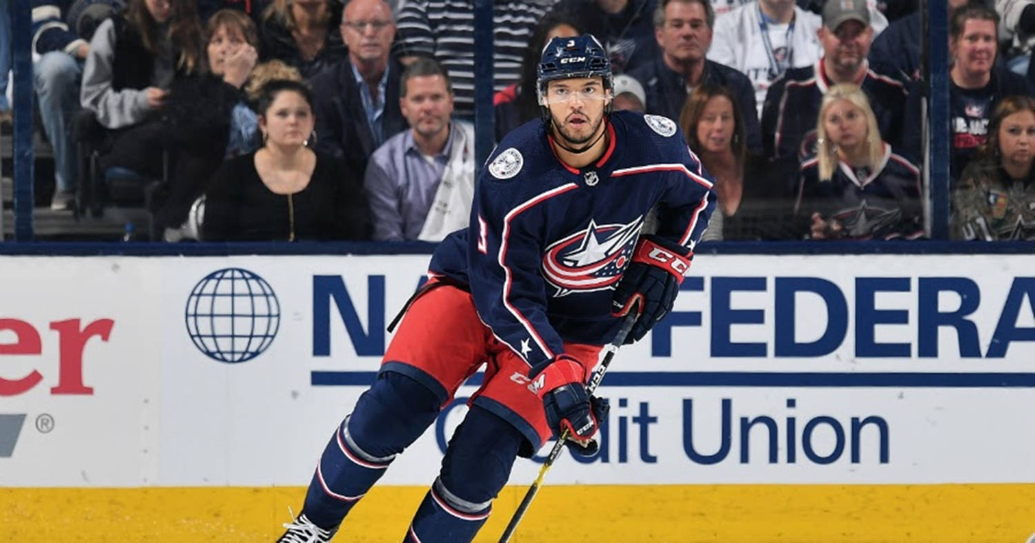 Seth Jones Leaning To The Left Holding Hockey Stick Background