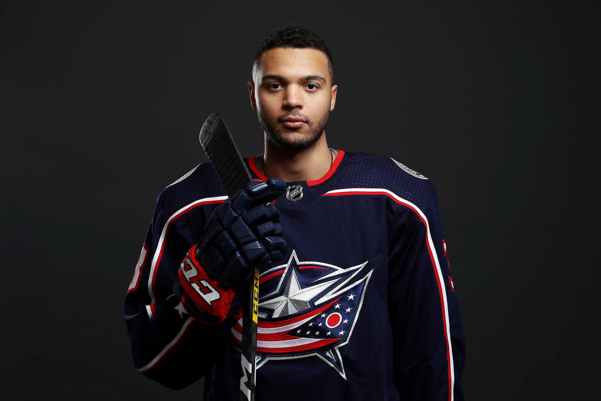 Seth Jones Posing With Hockey Stick For Columbus Blue Jackets Background