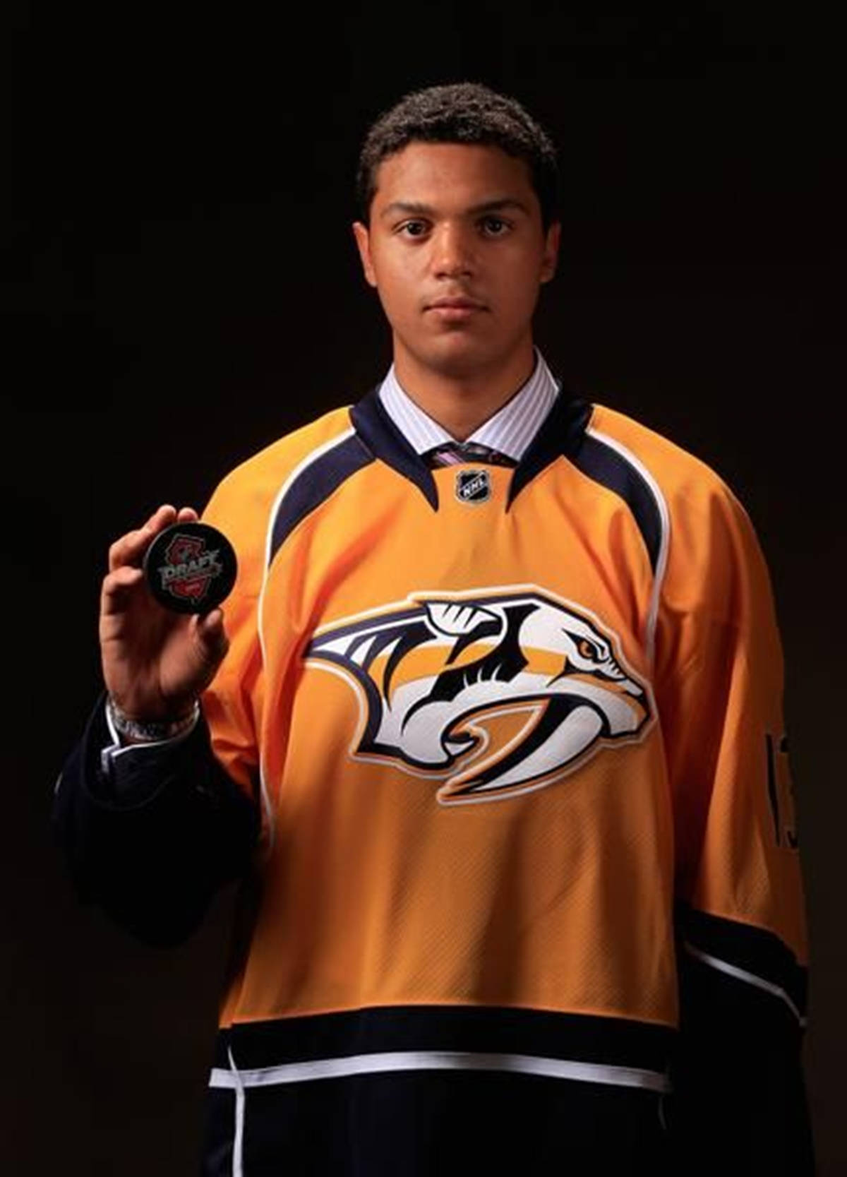 Seth Jones With Draft Hockey Puck Background