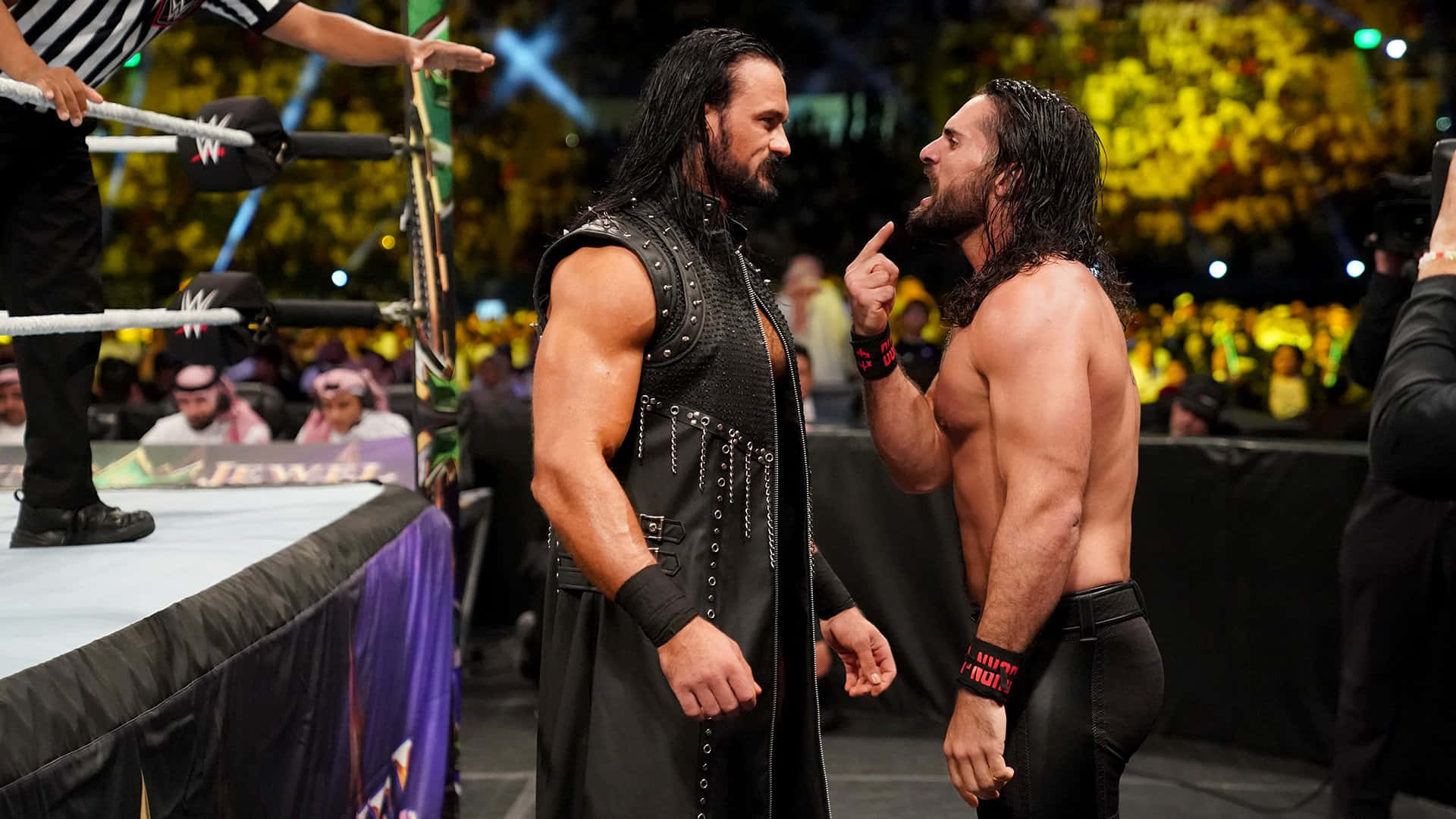 Seth Rollins Facing Roman Reigns Background