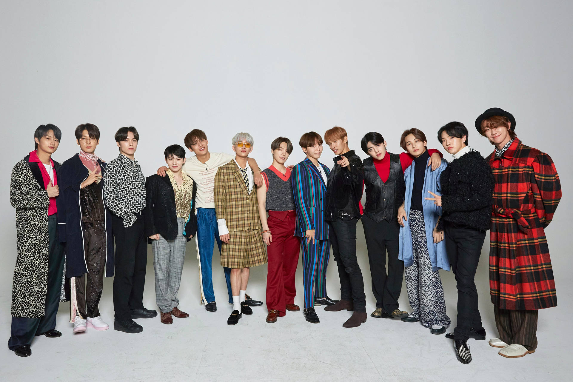 Seventeen Band Posing For A Magazine Shoot Background