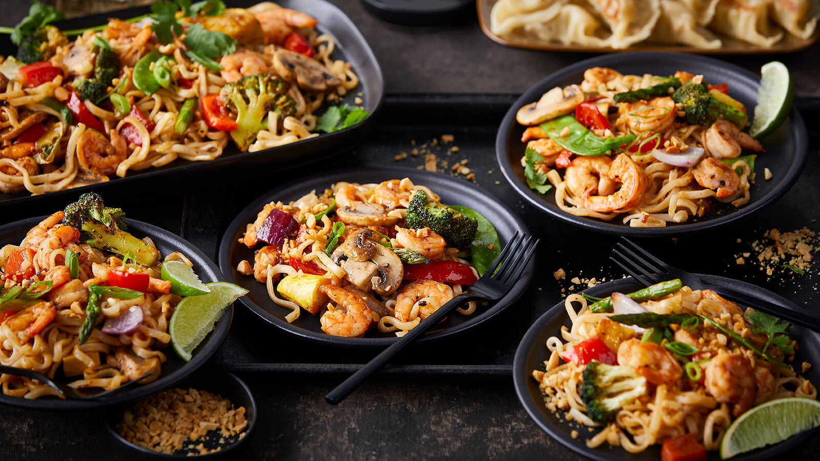 Several Pad Thai Noodles Platters Background