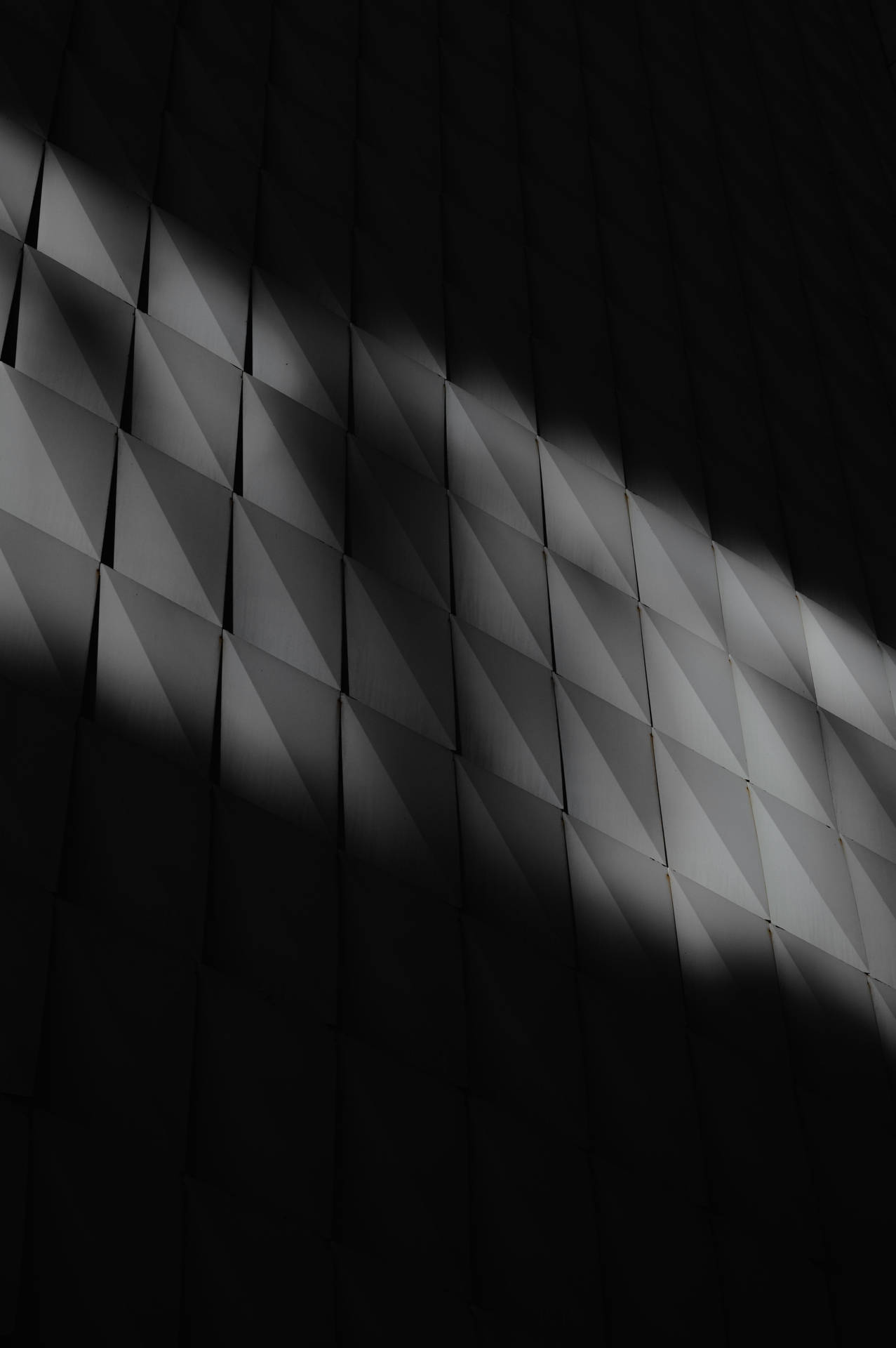 Shadowy Dark Wall Of Squares Background