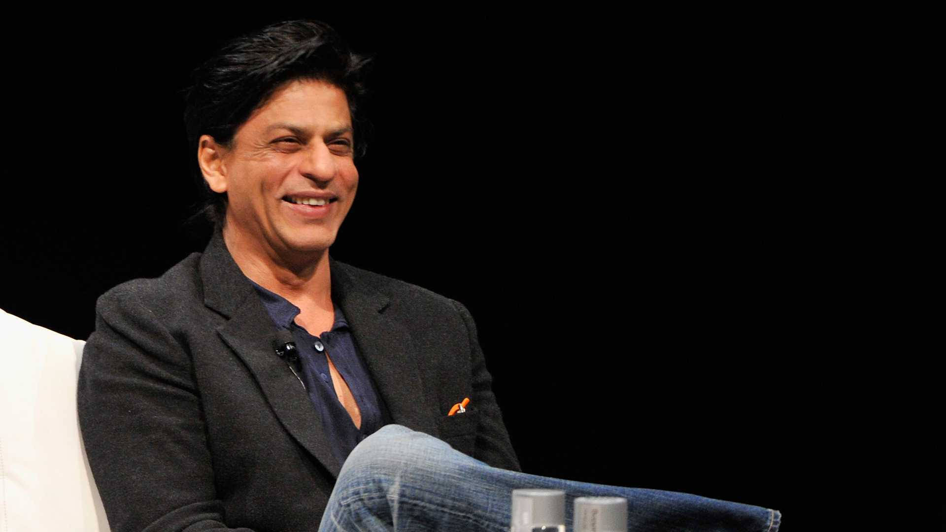 Shah Rukh Khan Iconic Smile Background