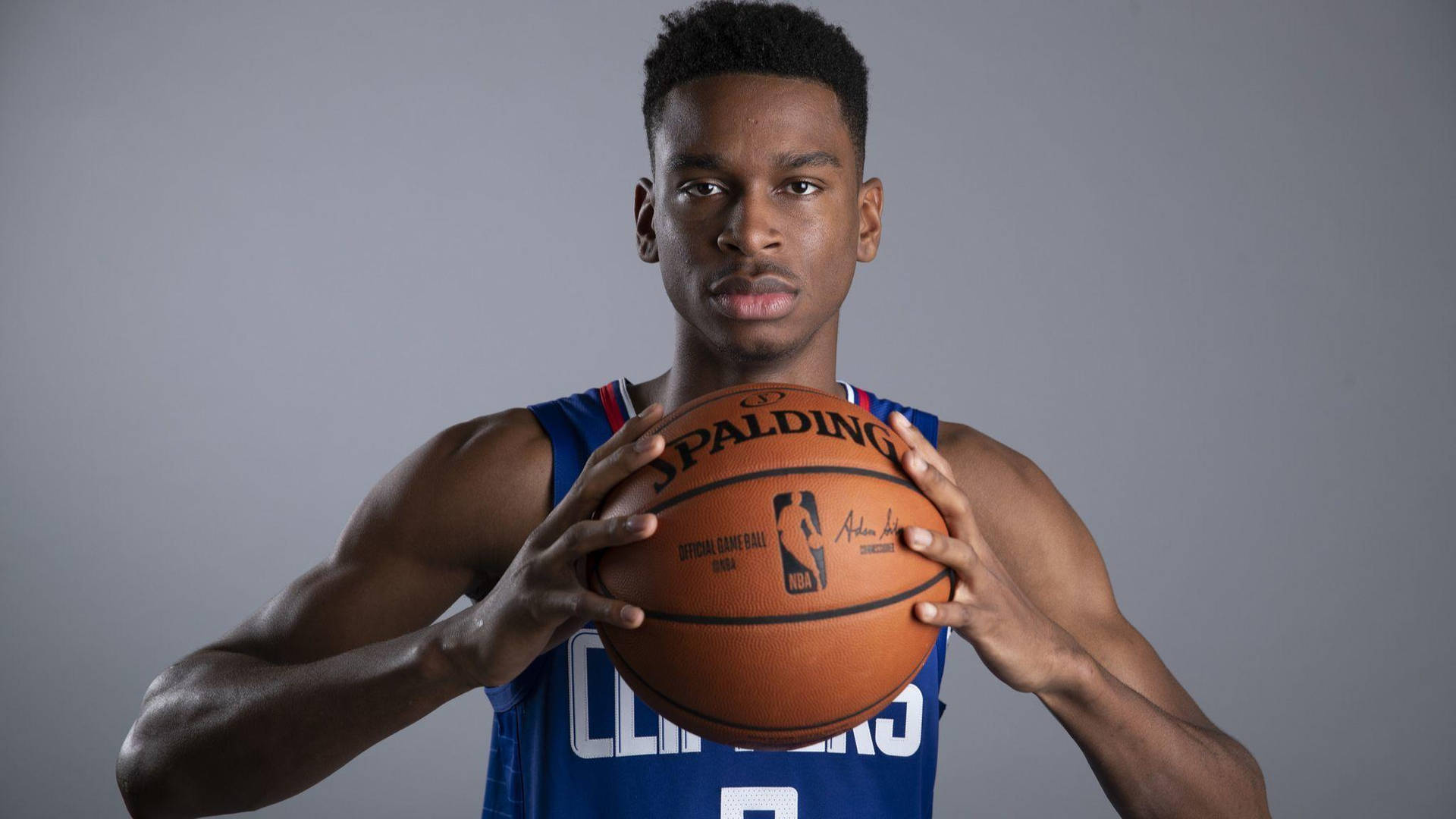 Shai Gilgeous Alexander Basketball Player Pose La Clippers Background