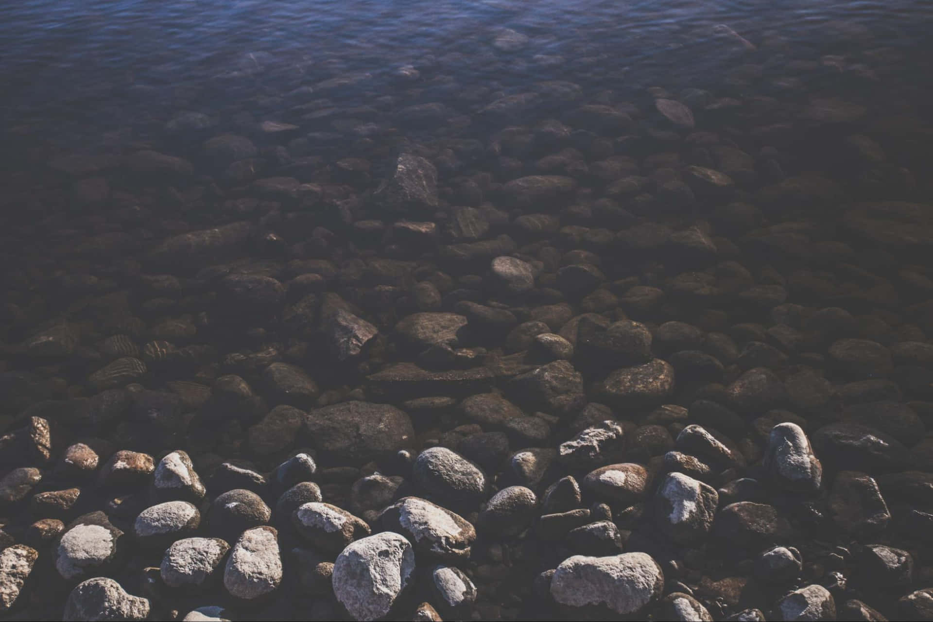 Shallow River Pebbles Background