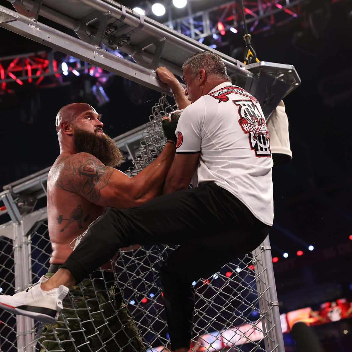 Shane Mcmahon Engaging With Braun Strowman In The Ring