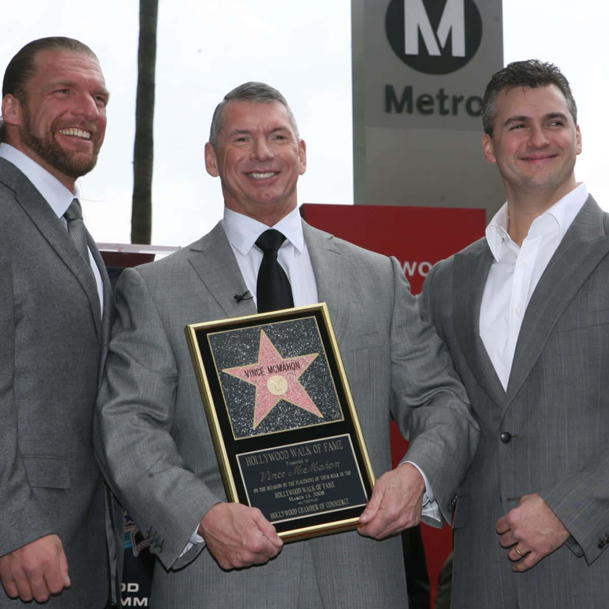 Shane Mcmahon Posing With Vince Mcmahon And Triple H
