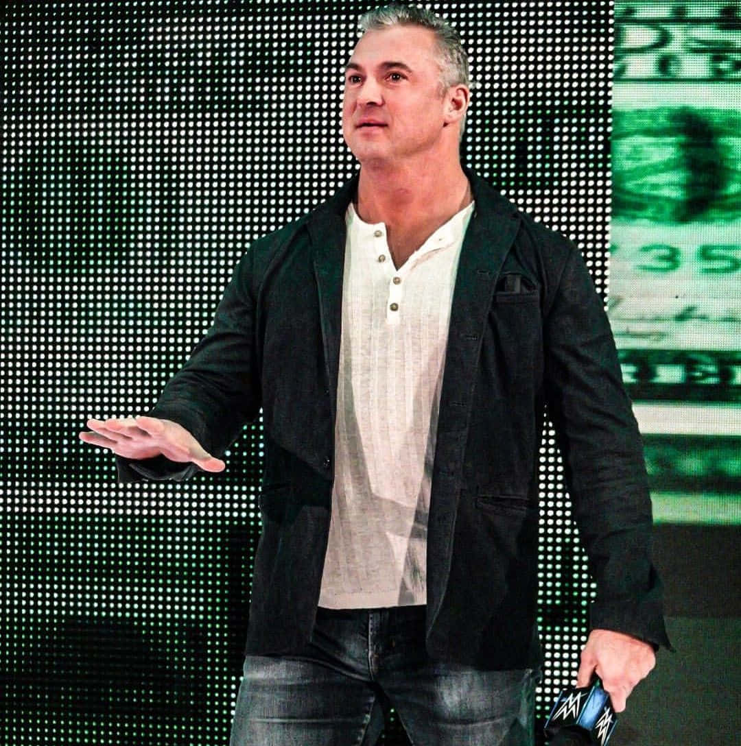 Shane Mcmahon Wrestler Wearing A Suit Background