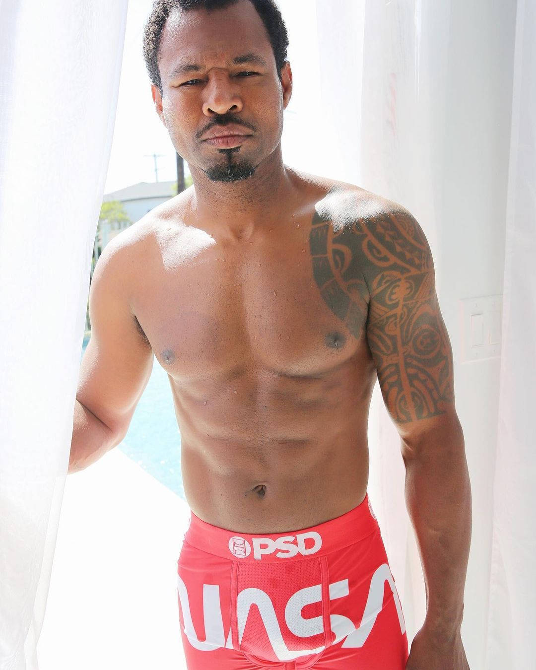 Shane Mosley Posing At Home Background