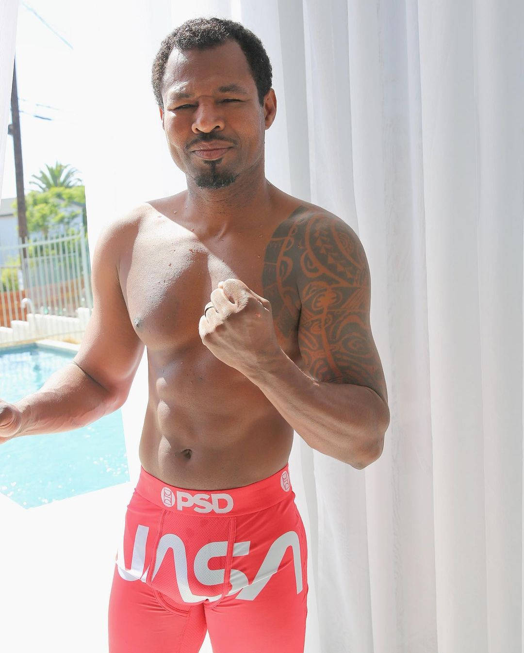 Shane Mosley Posing With Fist Background