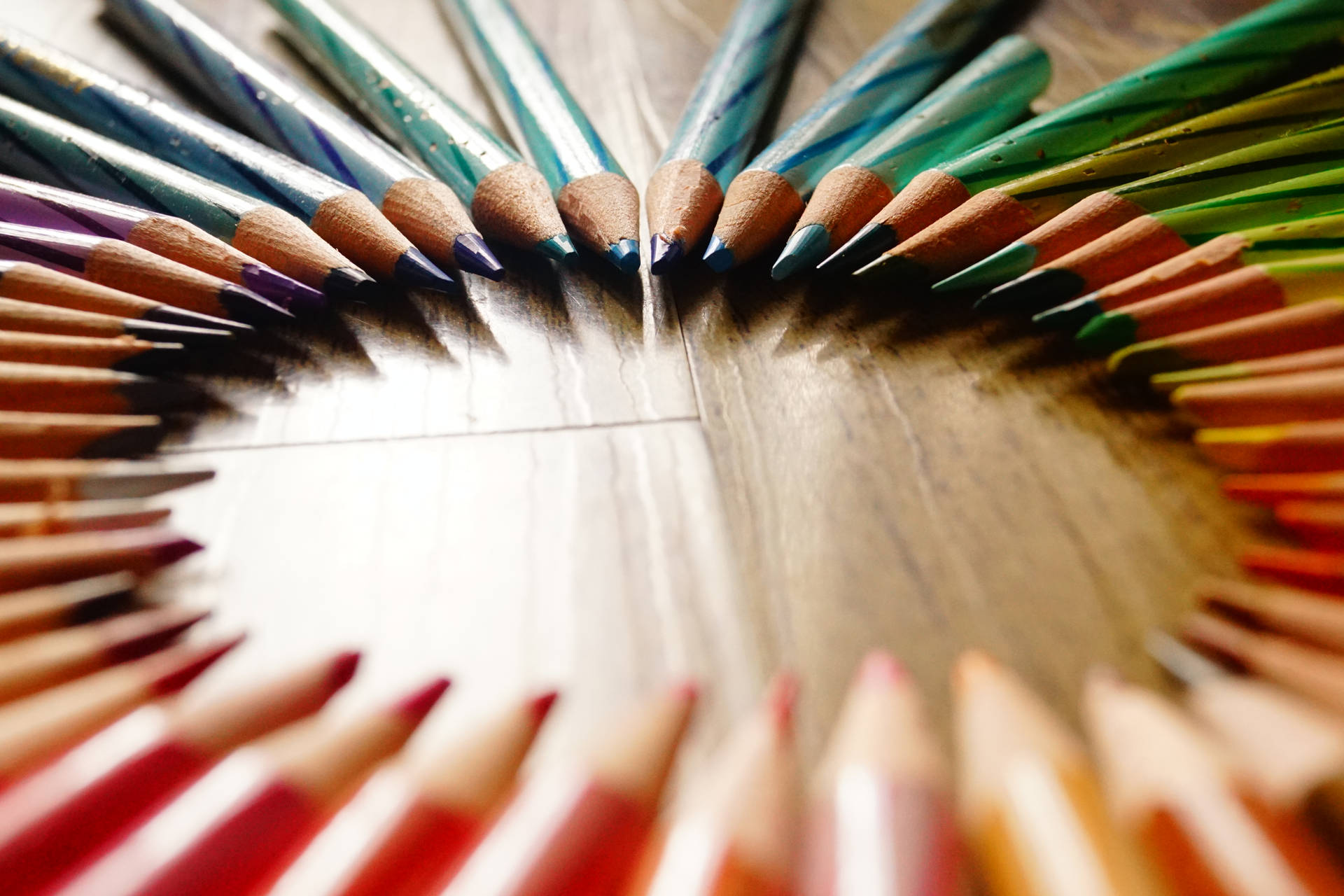 Sharp Colored Pencils In Circular Design Background