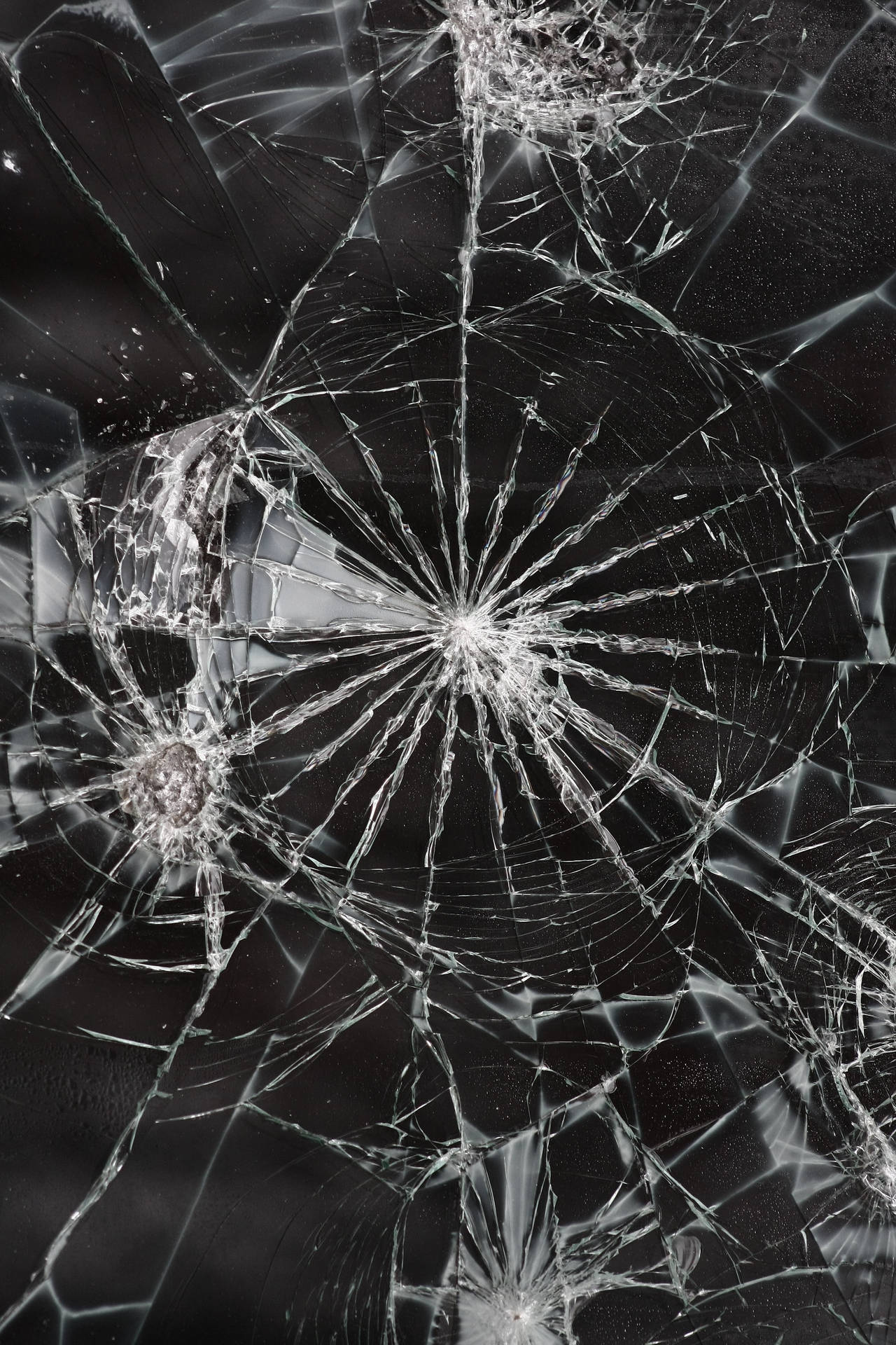 Shattered Illusions: A Broken Glass Close-up Background
