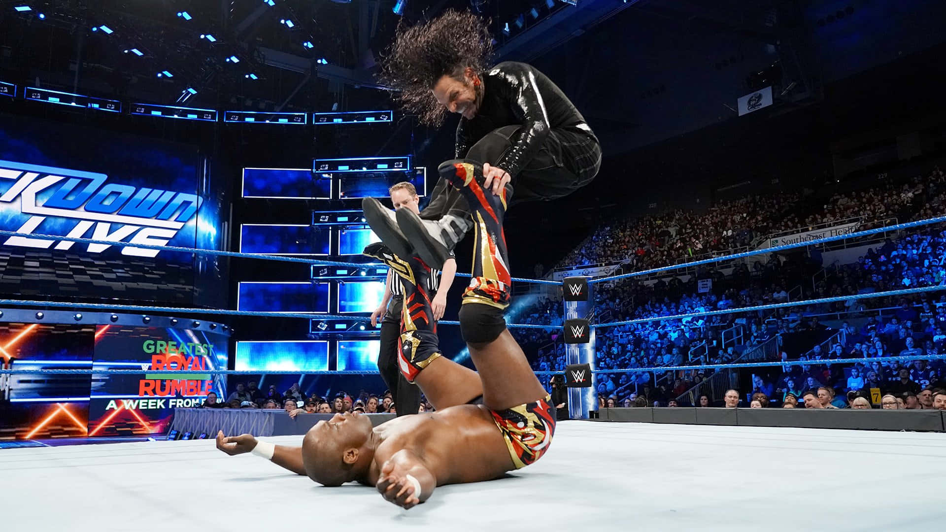 Shelton Benjamin In Action Against Jeff Hardy In Wwe Smackdown Background