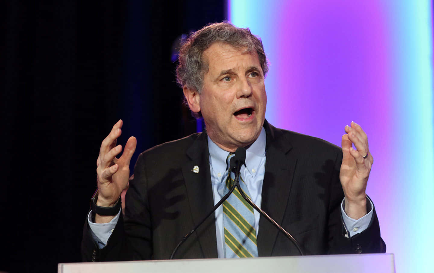 Sherrod Brown Expressively Gesturing During A Speech Background