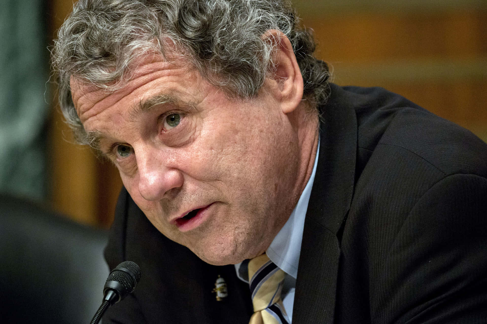 Sherrod Brown Leaning Forward Background