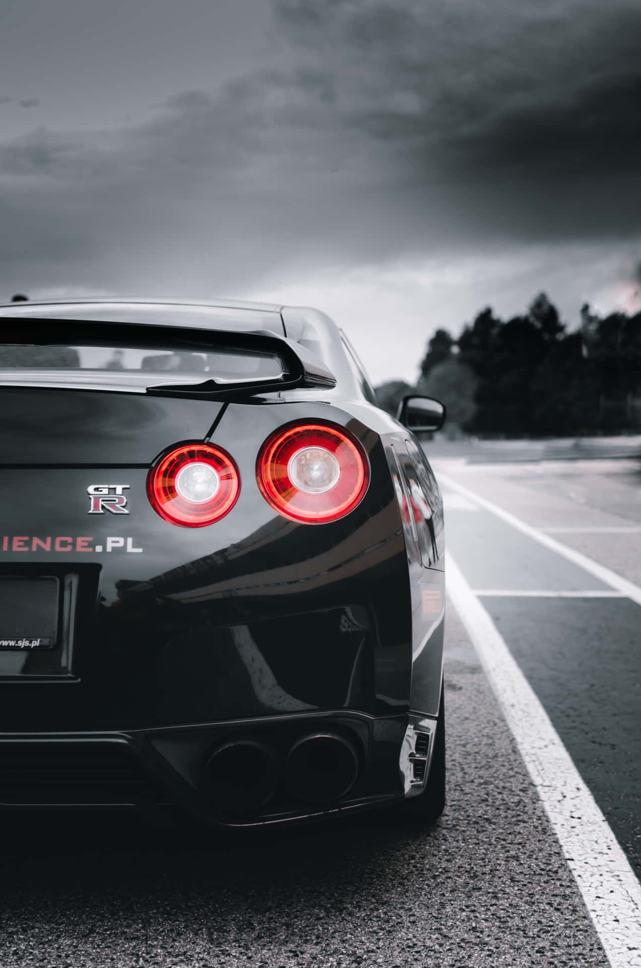 Shiny Black Nissan R35 Gtr Dark Clouds Background