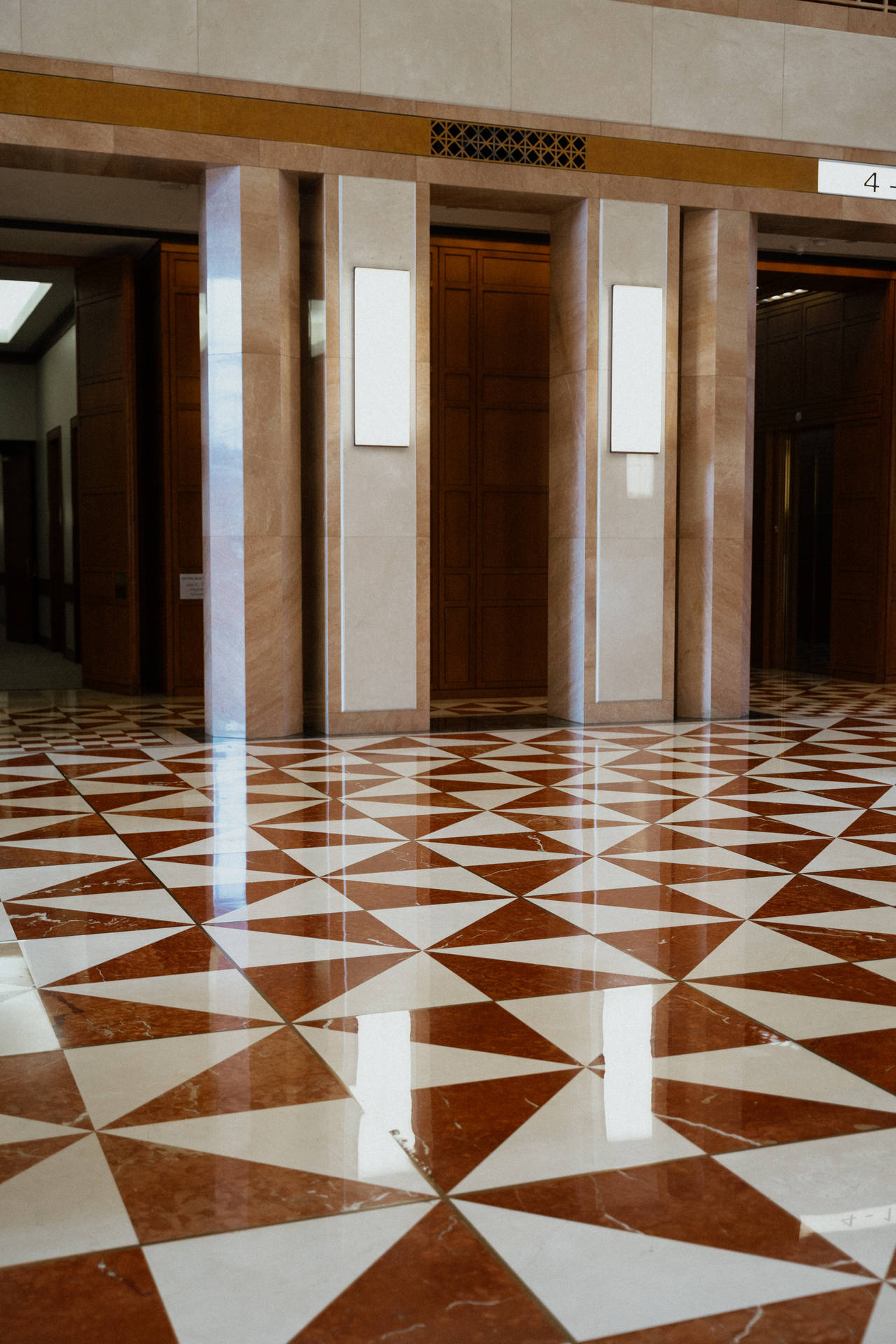 Shiny Elevator Corridor With Elegant Floor Tiles Background