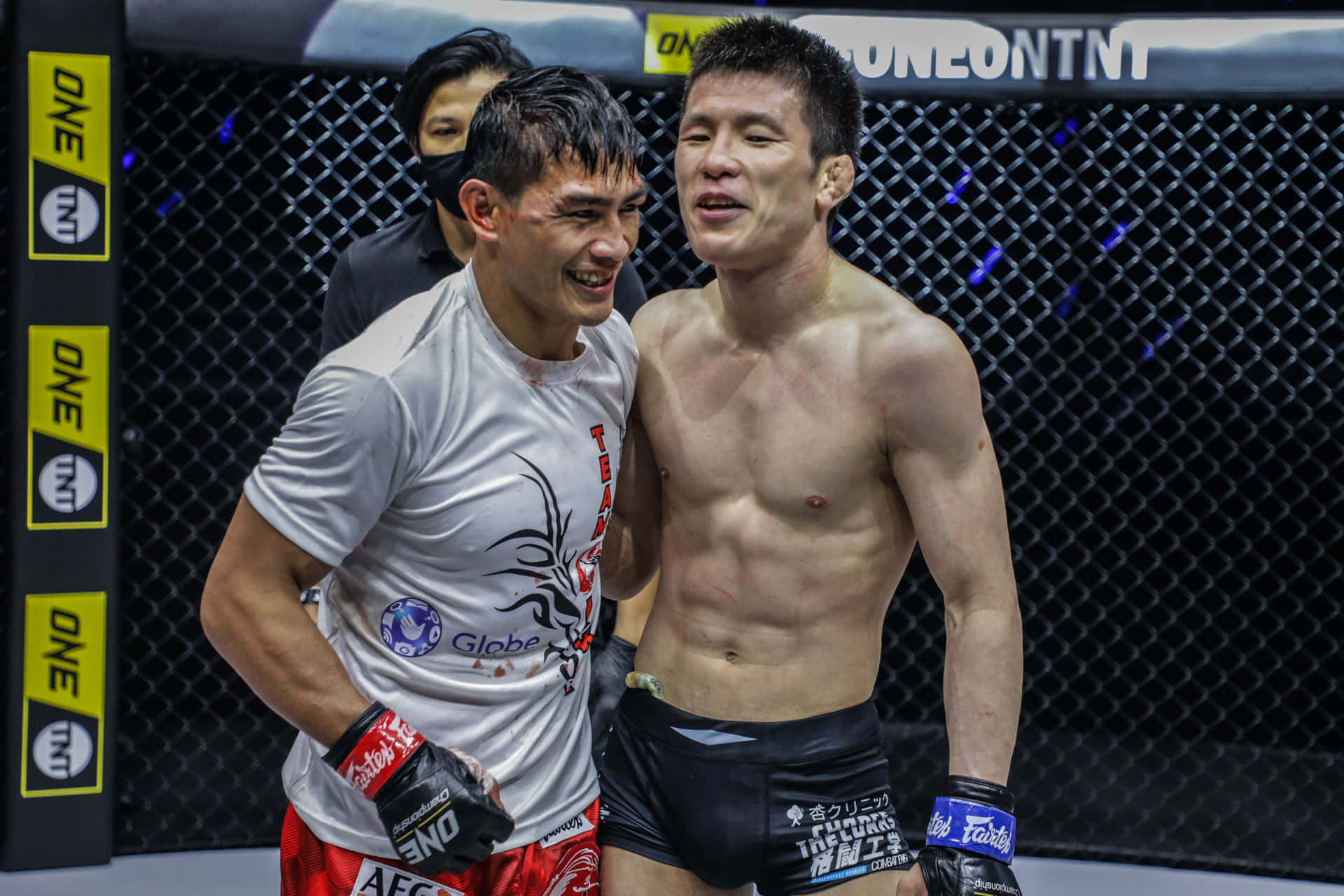 Shinya Aoki Smiling With Eduard Folayang Background