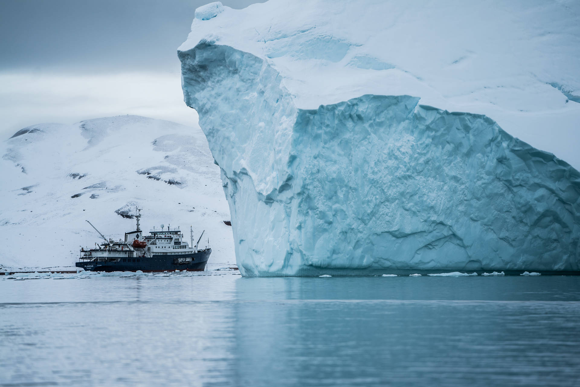 Ship Near Greenland Iceberg Background