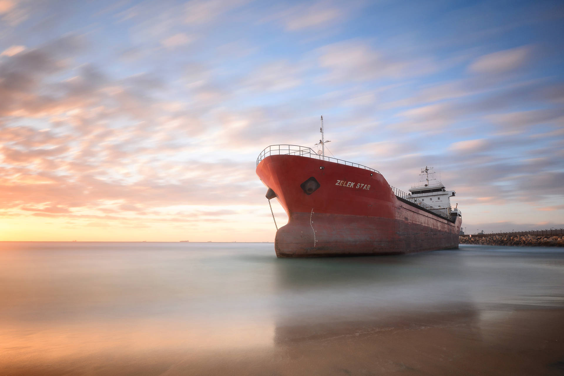 Ship Under Colorful Skies Background