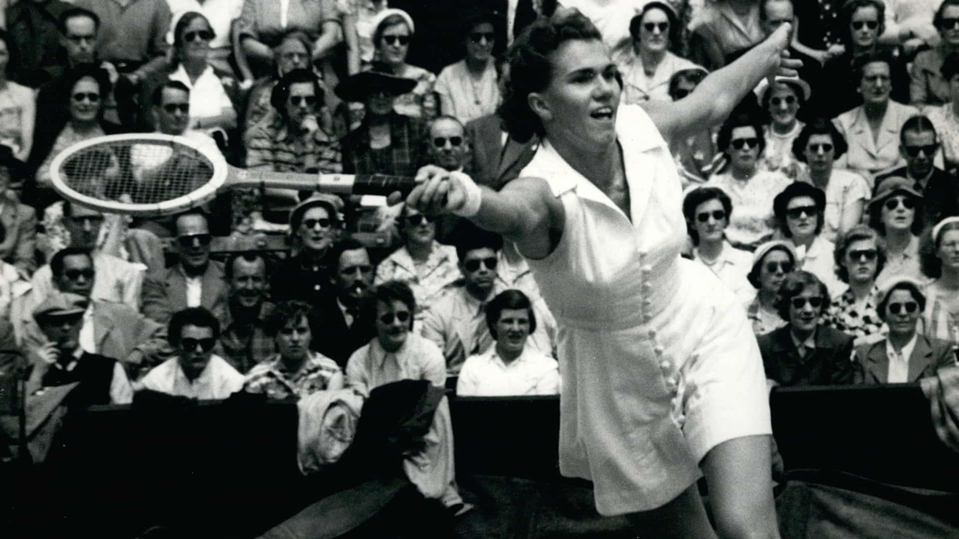 Shirley Fry Irvin Holding Grand Slam Championship Trophy Background