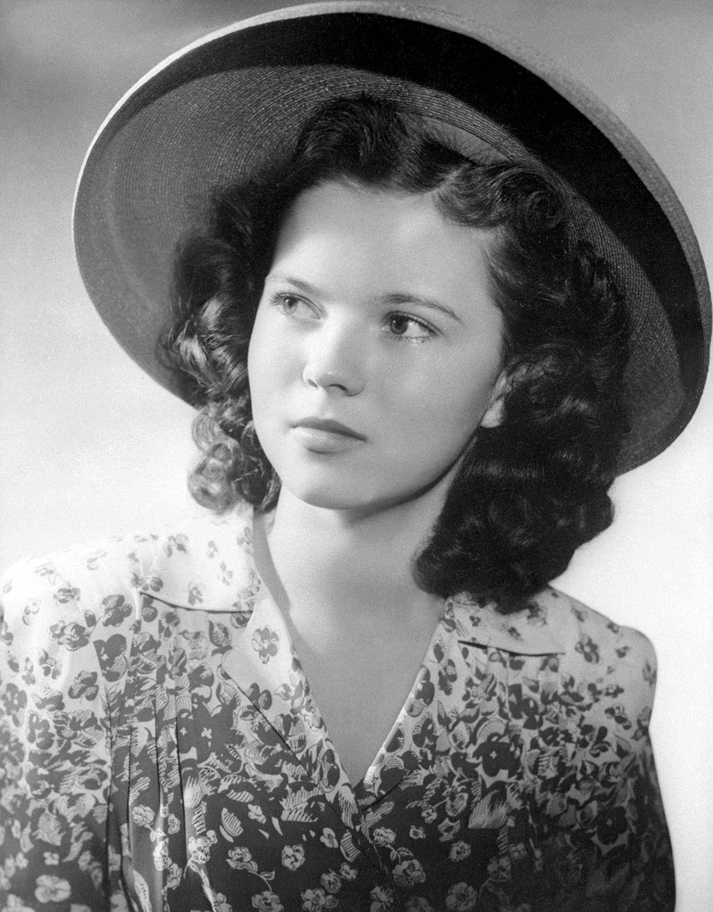 Shirley Temple In A Floral Dress Background